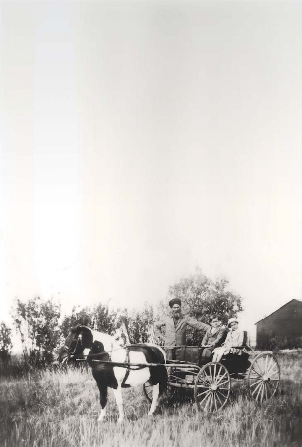Harnam Singh Hari with two grandchildren (possibly Harnet Singh and Satnam Kaur), Glenmore farm, Calgary, c. 1936